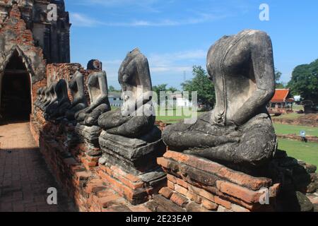 Row of headless Buddha`s statues at Wat Chaiwatthanaram, Thailand Stock Photo